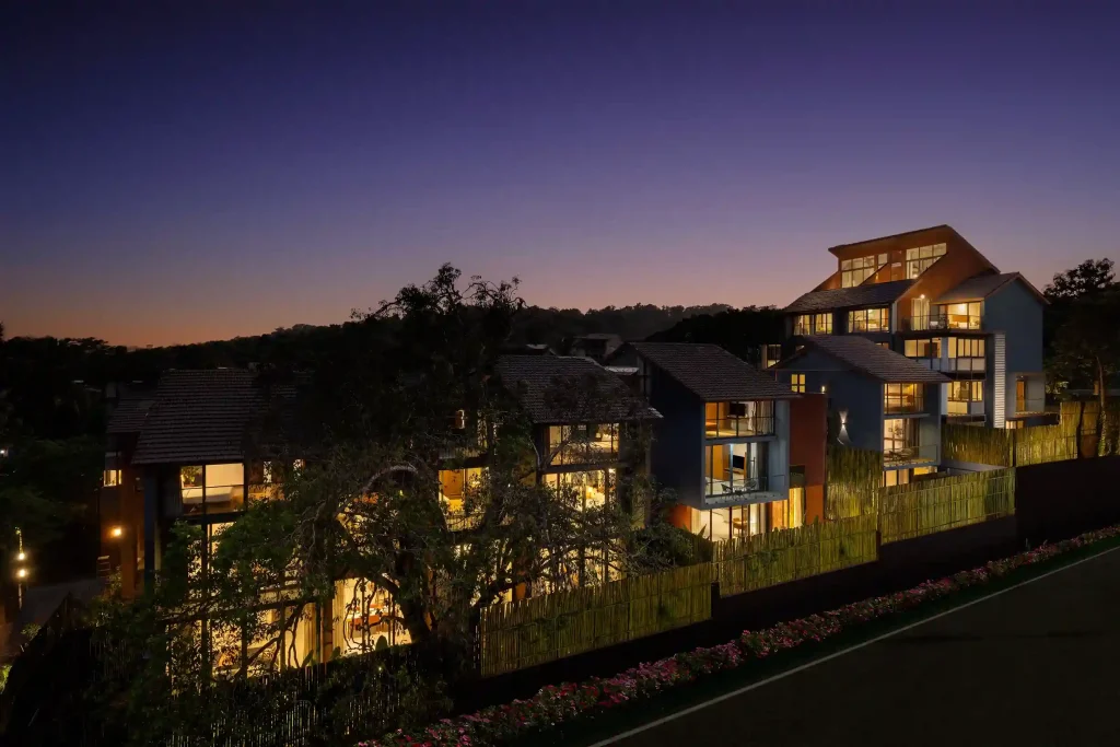 Image of The Terraces illuminated at night, presenting sophisticated architecture